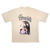 Camisa oversized bege com escrita QIX CHORÃO, com imagens do cantor e frase "Coração vagabundo bate na sola do pé" na parte inferior.