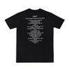 Parte de trás da camiseta preta Charlie Brown Jr, discografia do álbum Transpiração Contínua Prolongada em letras brancas.